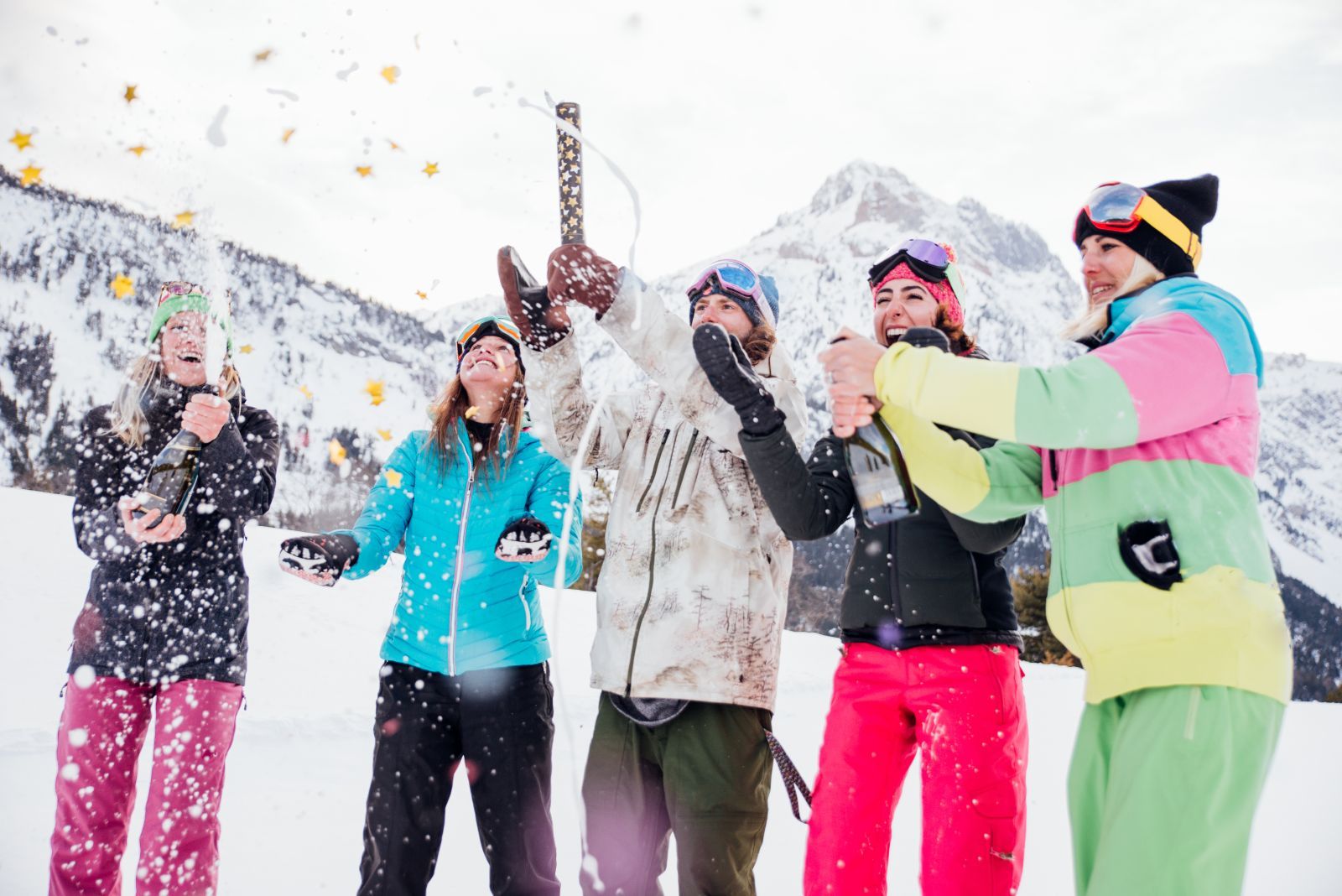 friends celebrating new years on the slopes